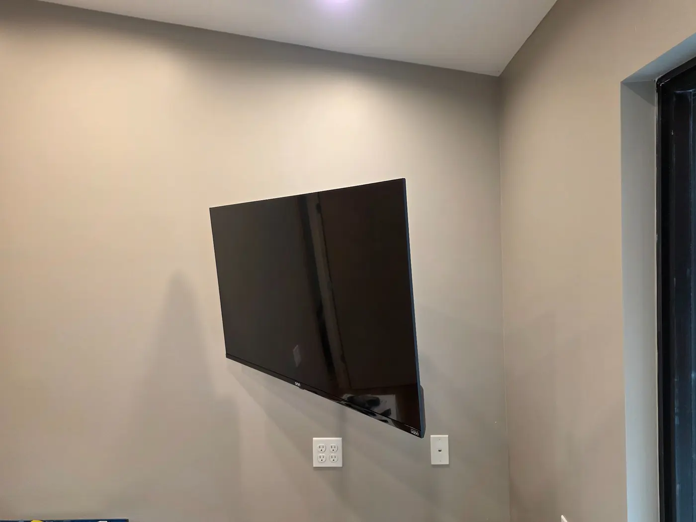 Television installed on a full-motion wall mount