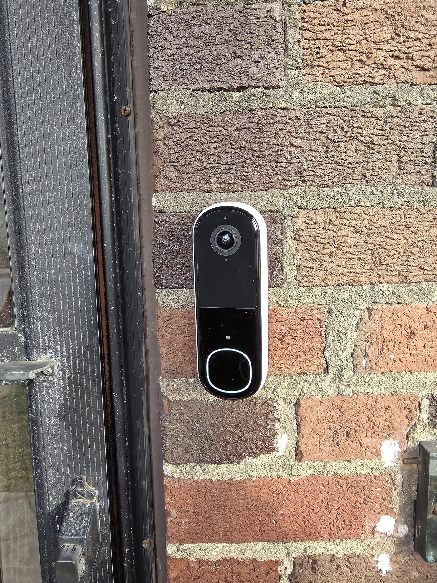 Video doorbell securely mounted on brick at a Cincinnati home