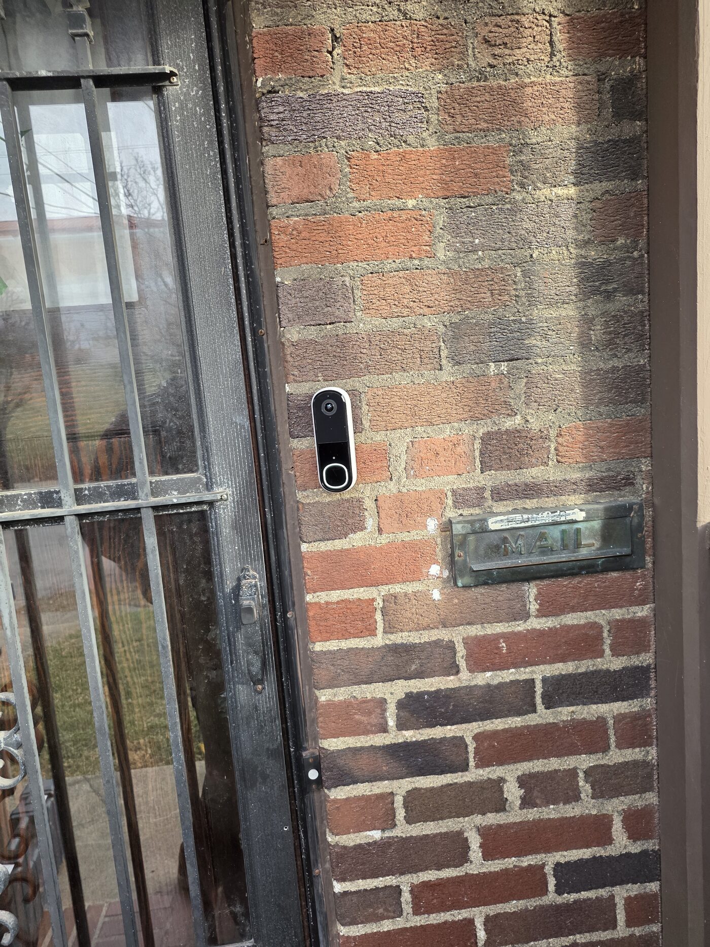 Video doorbell positioned beside the front entrance of a Cincinnati home